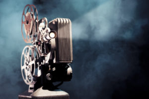 write a screenplay photo of an old movie projector
